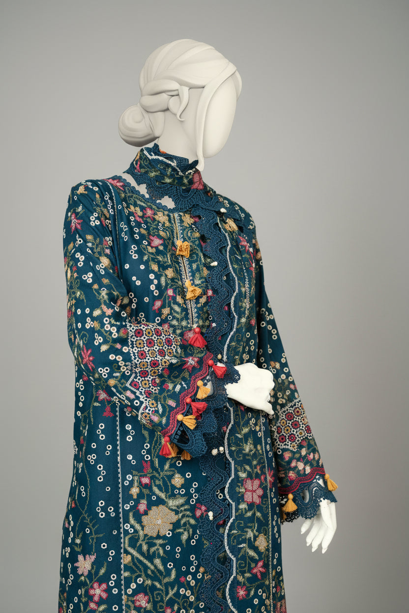 Mannequin wearing a decorative blue outfit with floral patterns and colorful tassels in an indoor setting.