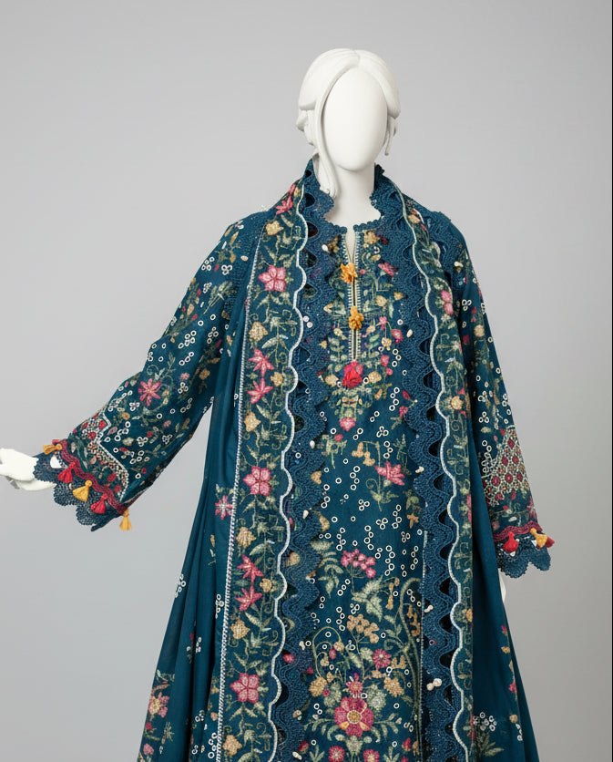 Mannequin wearing a dark blue embroidered jacket in a decorative room.