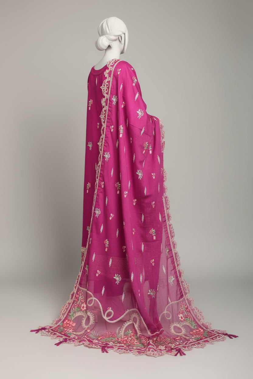Mannequin wearing a pink embroidered dupatta in a room with a checkered floor.