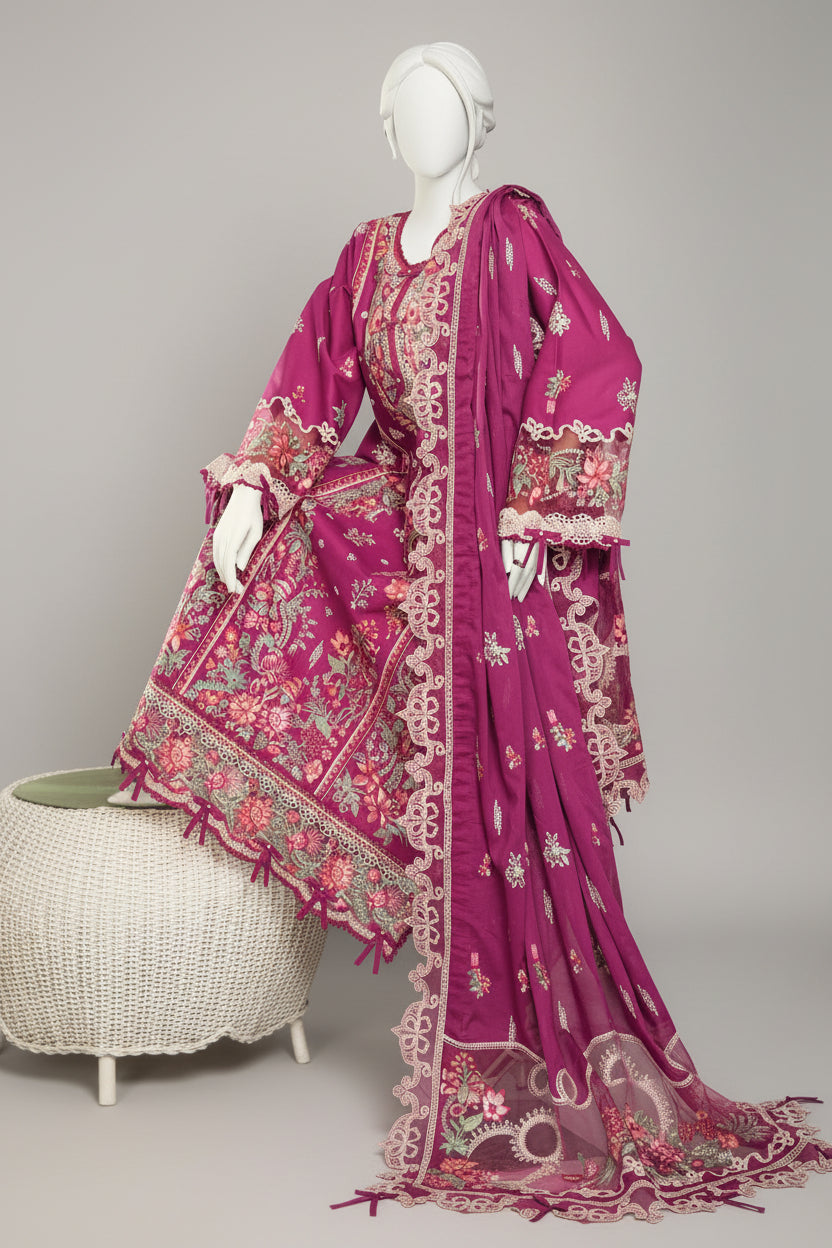 Mannequin wearing a vibrant pink saree with intricate patterns in a room setting.
