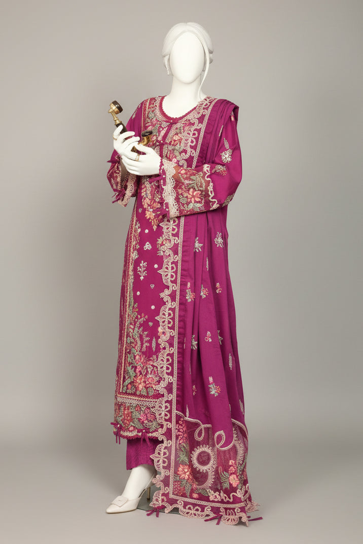 Mannequin wearing a vibrant purple dress with floral patterns in a room with white curtains and a plant.