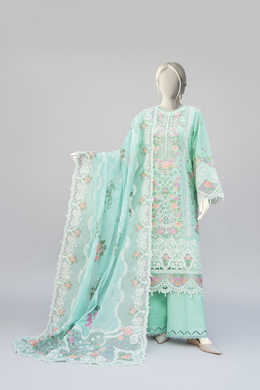 Light green embroidered outfit on a mannequin with a garden background
