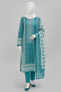 A woman wearing a teal and white printed three-piece traditional outfit with a matching dupatta, standing in front of an ornate courtyard with arches.