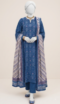 A blue three-piece salwar kameez suit set displayed on a white mannequin, featuring a printed kurta, matching trousers, and a patterned dupatta, set against a plain beige background.