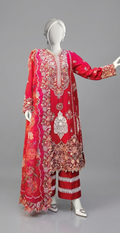 Traditional red embroidered outfit on a mannequin against a gray background