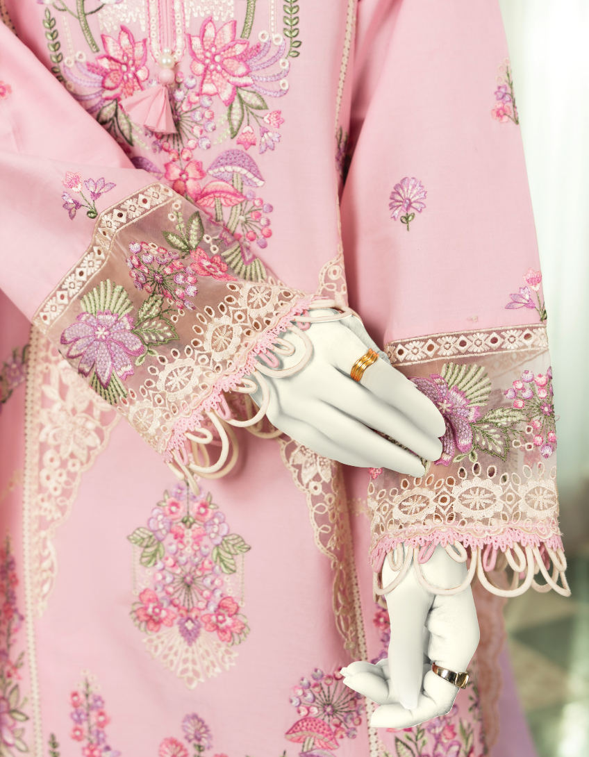 Close-up of a pink embroidered garment with floral patterns and lace details.