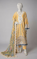 Mannequin wearing a yellow embroidered dress with floral patterns on a gray background