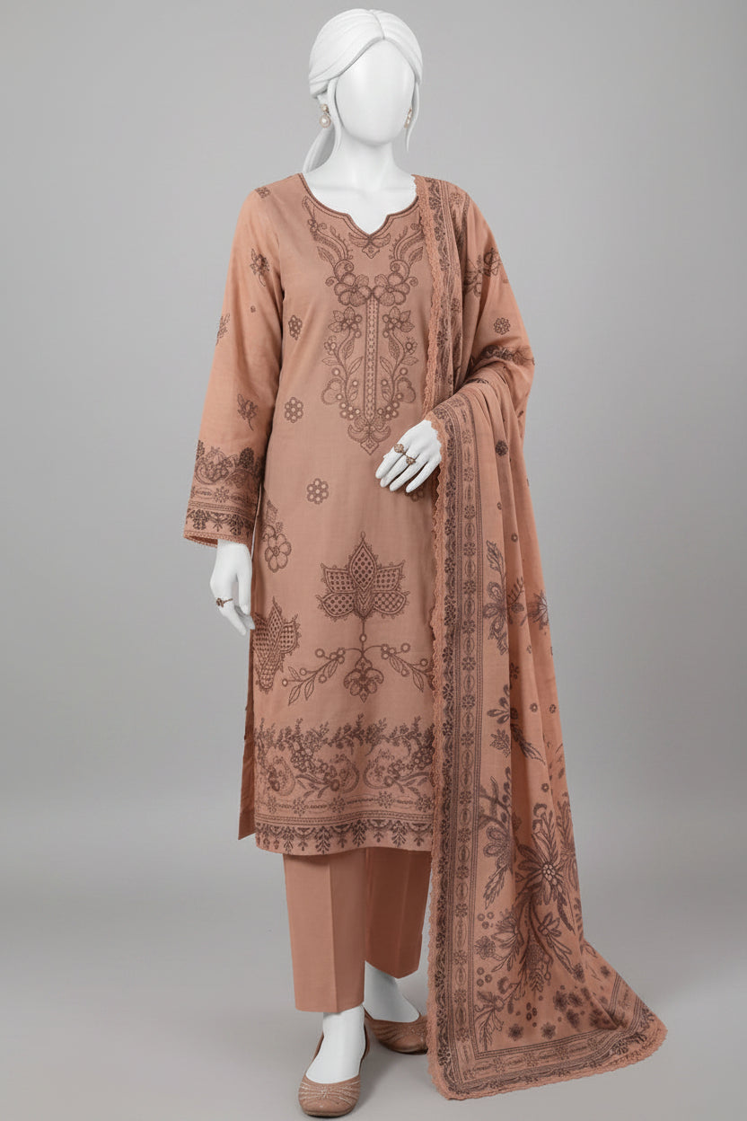 A three-piece women's ethnic suit set displayed on a female mannequin. The set includes a light brown kurta with dark brown floral embroidery, matching trousers, and a coordinating dupatta with a detailed border pattern, set against a solid pink studio background.