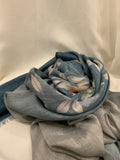 Slate blue and grey printed lawn scarf with pastel florals and frayed edges