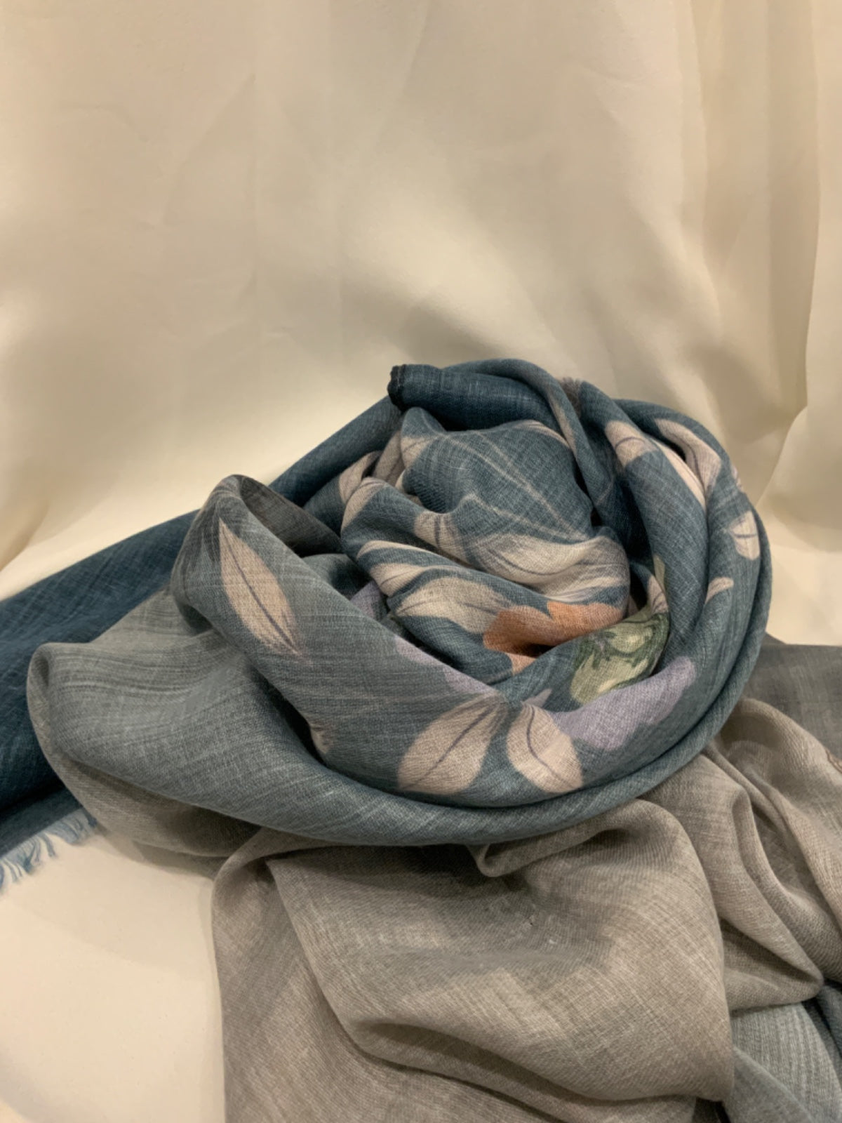 Slate blue and grey printed lawn scarf with pastel florals and frayed edges